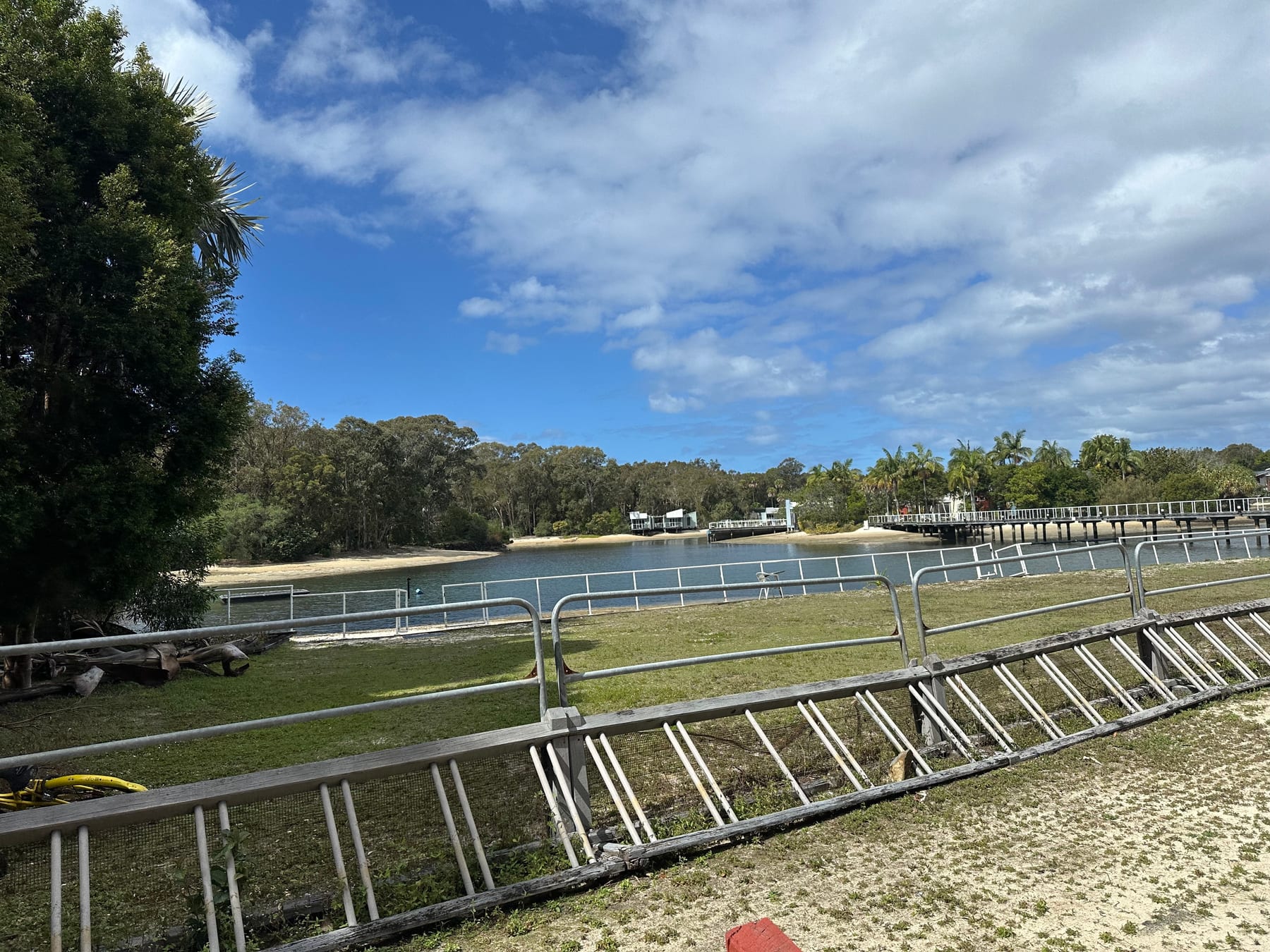 Lagoon and lodge buildings viewed from a marina-side walkway